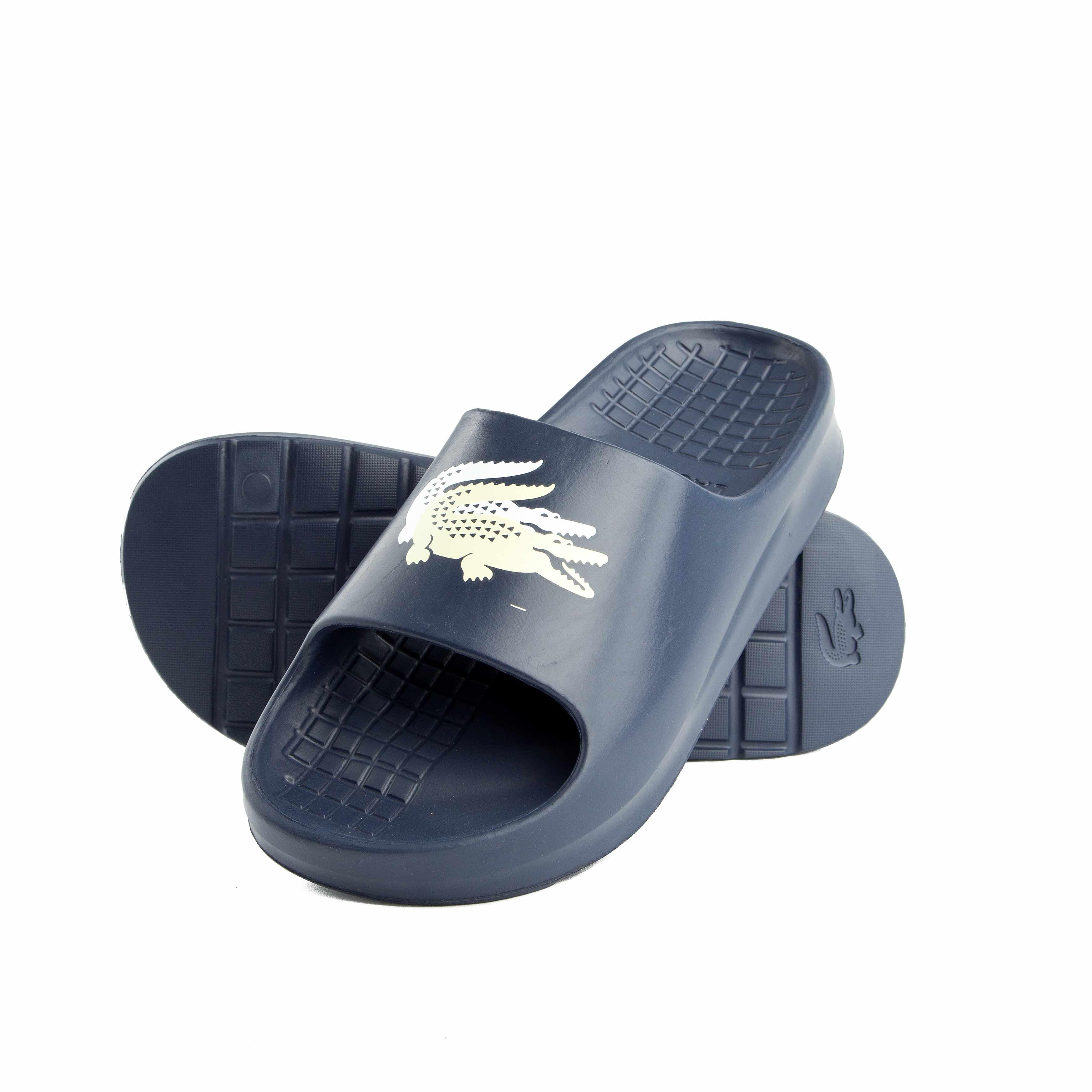 This is a pair of classic slide sandals from Lacoste.