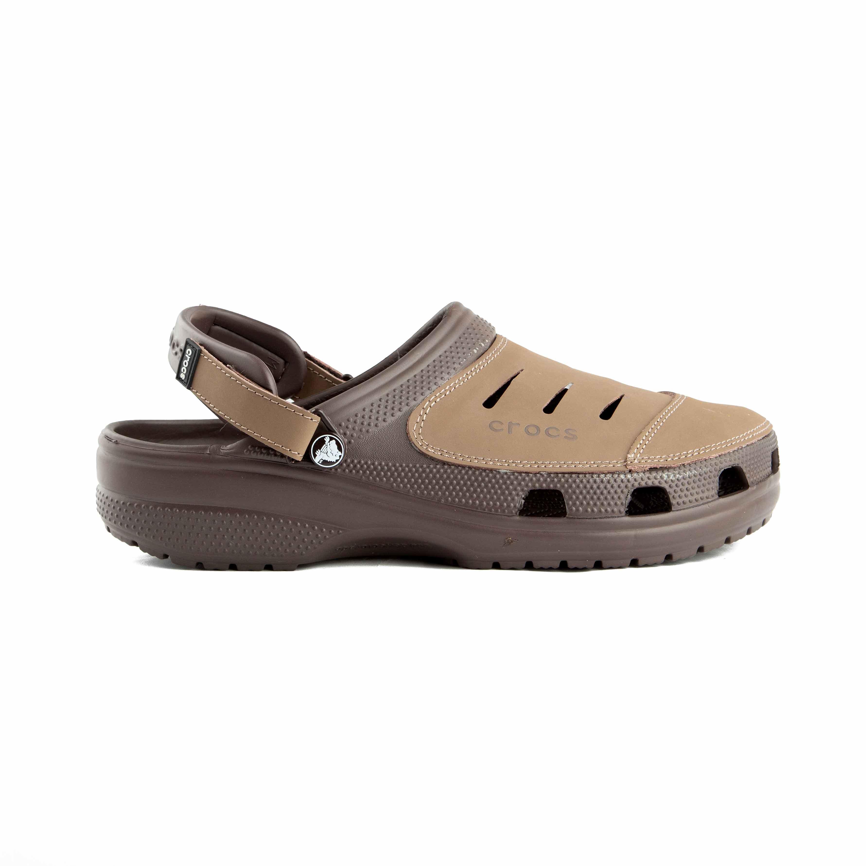 This is a pair of multi-toned brown Crocs clogs designed for rugged or water-friendly environments.