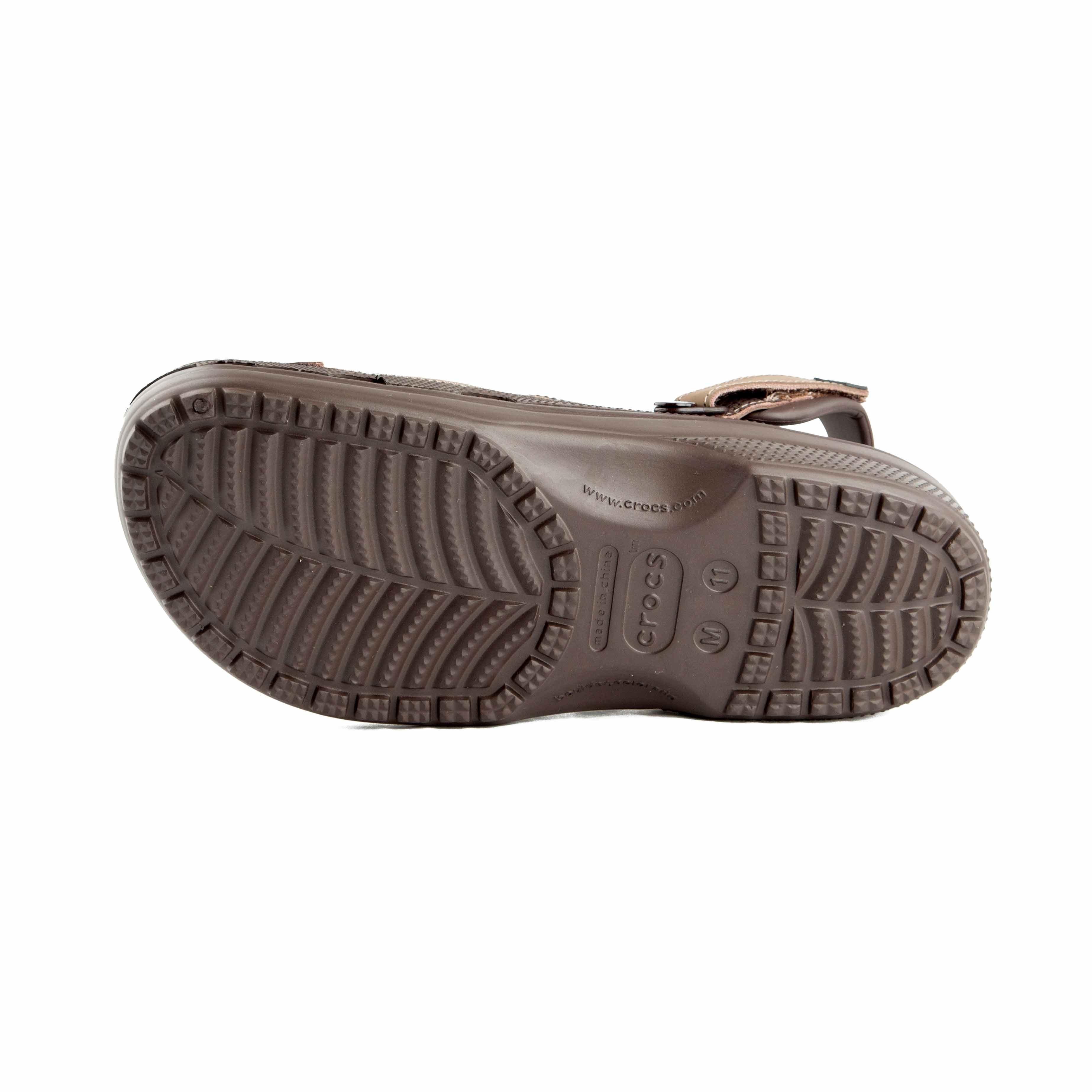 This is a pair of multi-toned brown Crocs clogs designed for rugged or water-friendly environments.