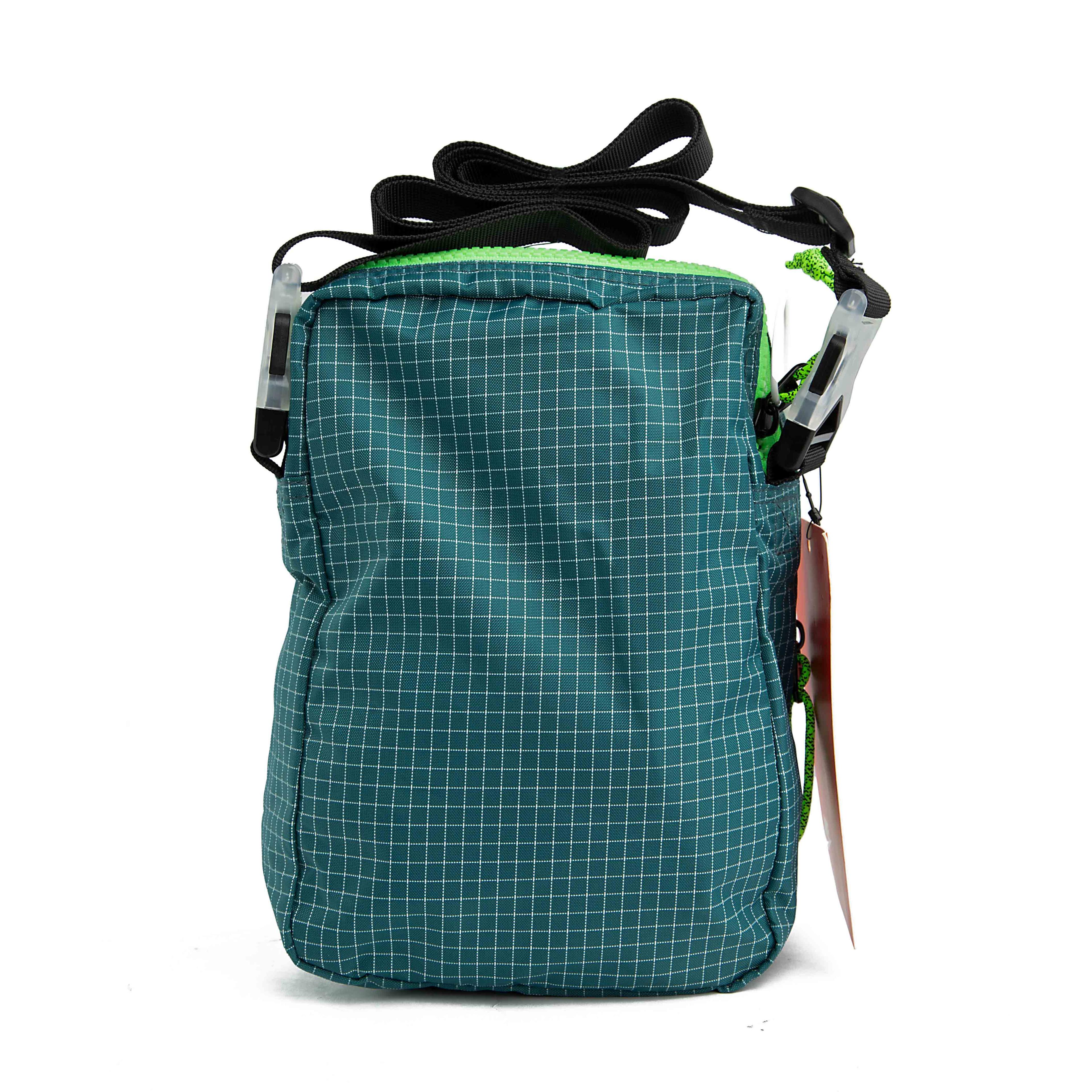 Carry your essentials in style with this unique teal grid-patterned shoulder bag. 