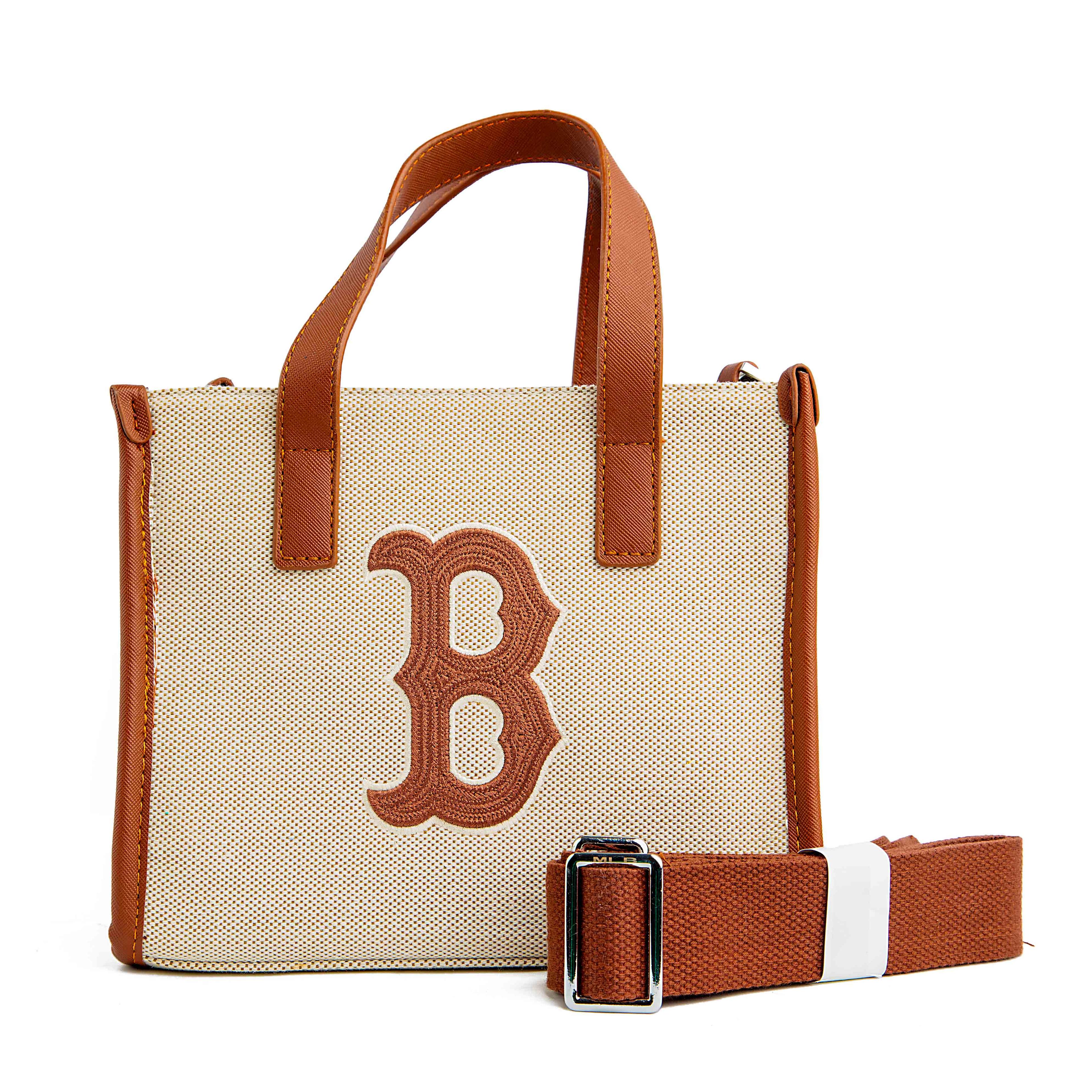 This is a stylish and compact tote bag featuring the Boston Red Sox logo. 