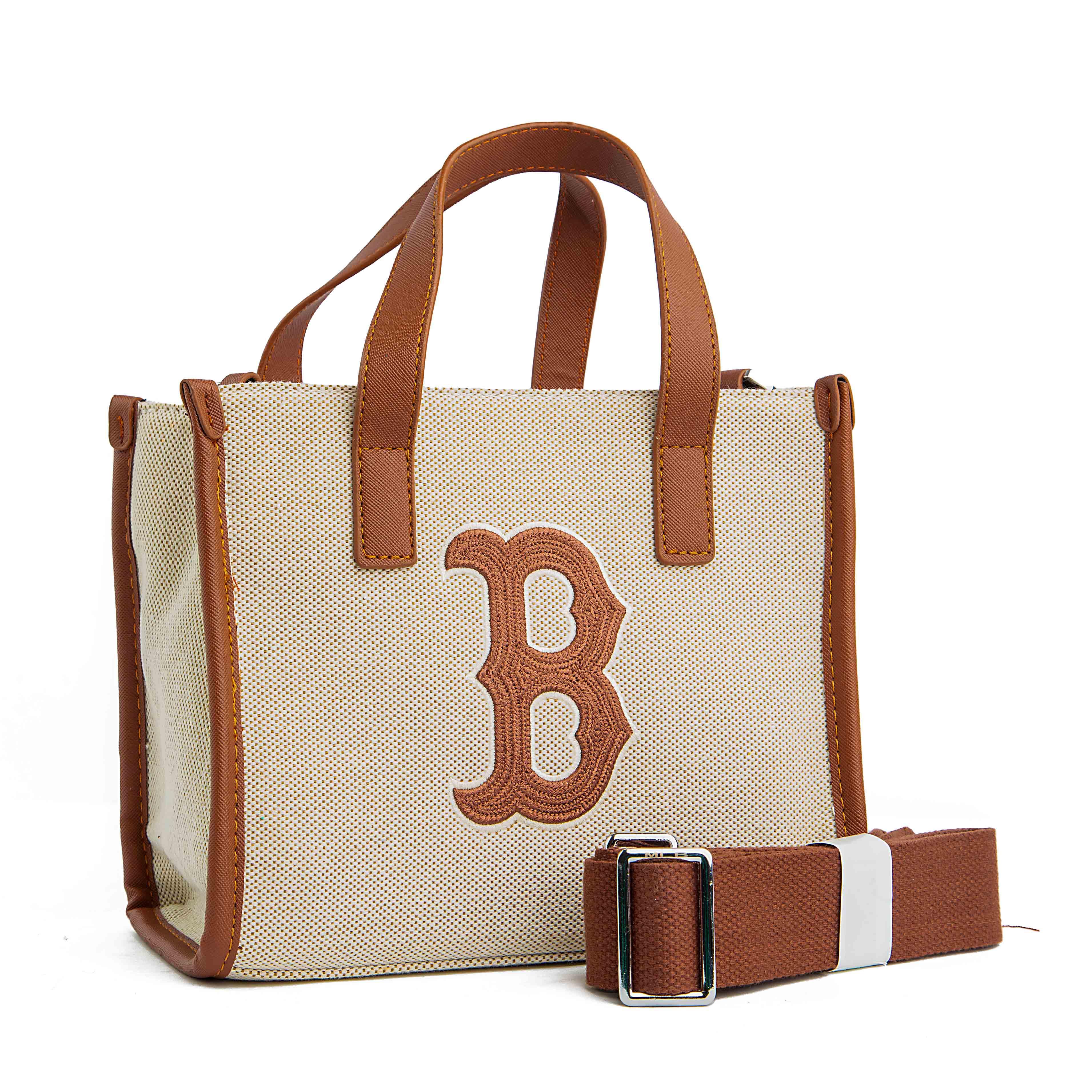 This is a stylish and compact tote bag featuring the Boston Red Sox logo. 