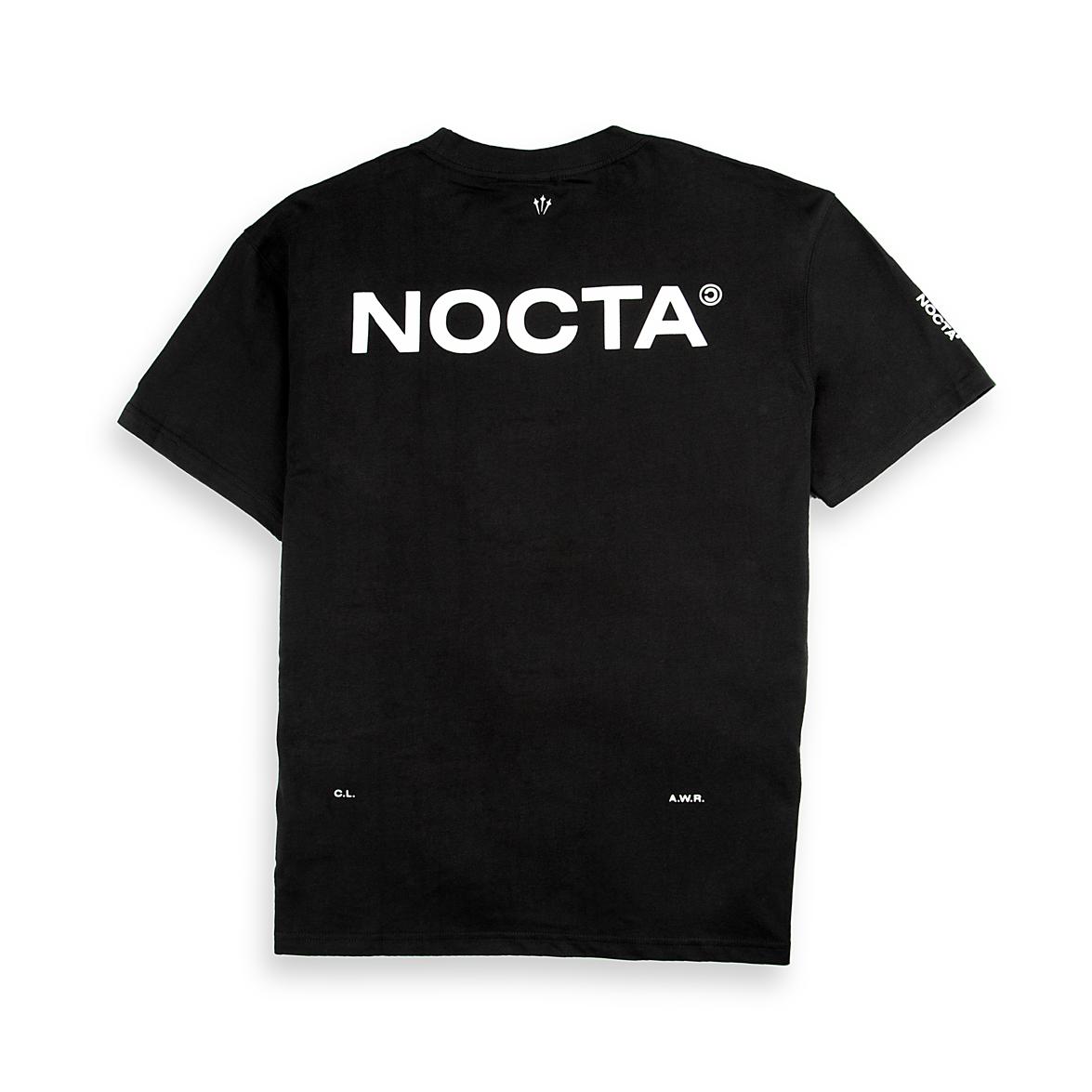 Back of a black Nike x NOCTA t-shirt with a large white "NOCTA" logo printed on it.