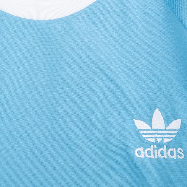  Elevate your everyday style with the timeless Adidas Originals 3-Stripes T-shirt in refreshing sky blue. Iconic comfort meets classic design