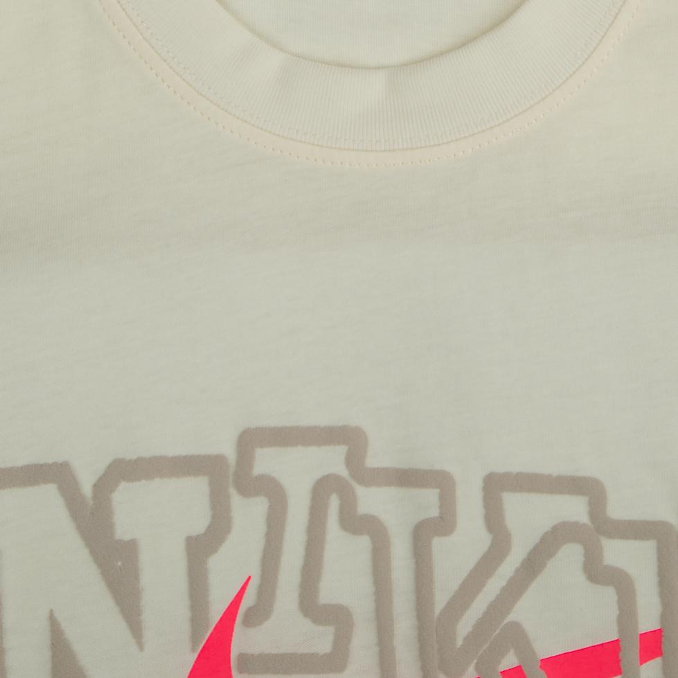 The Nike Tee" Graphic T-shirt. This tee offers a relaxed, stylish fit and features a unique graphic with a bold, contrasting Swoosh. It's a comfortable and eye-catching essential for everyday wear.