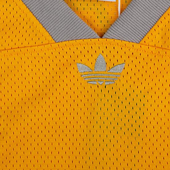 Adidas Originals mesh jersey. This unisex yellow jersey features a large "03" graphic, striped sleeves, and a lightweight feel for a sporty look