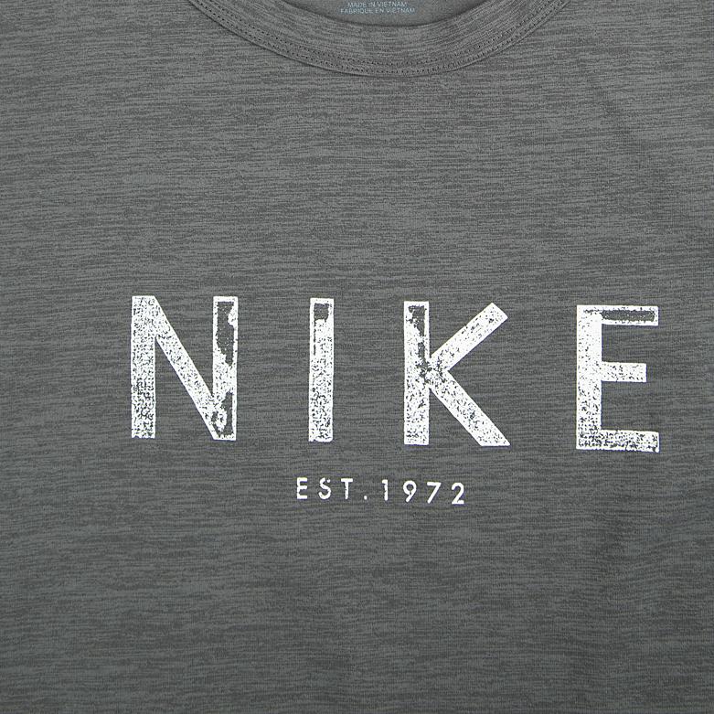 A heathered grey Nike Heritage T-shirt with a distressed white "NIKE" and "EST. 1972" logo on the chest.