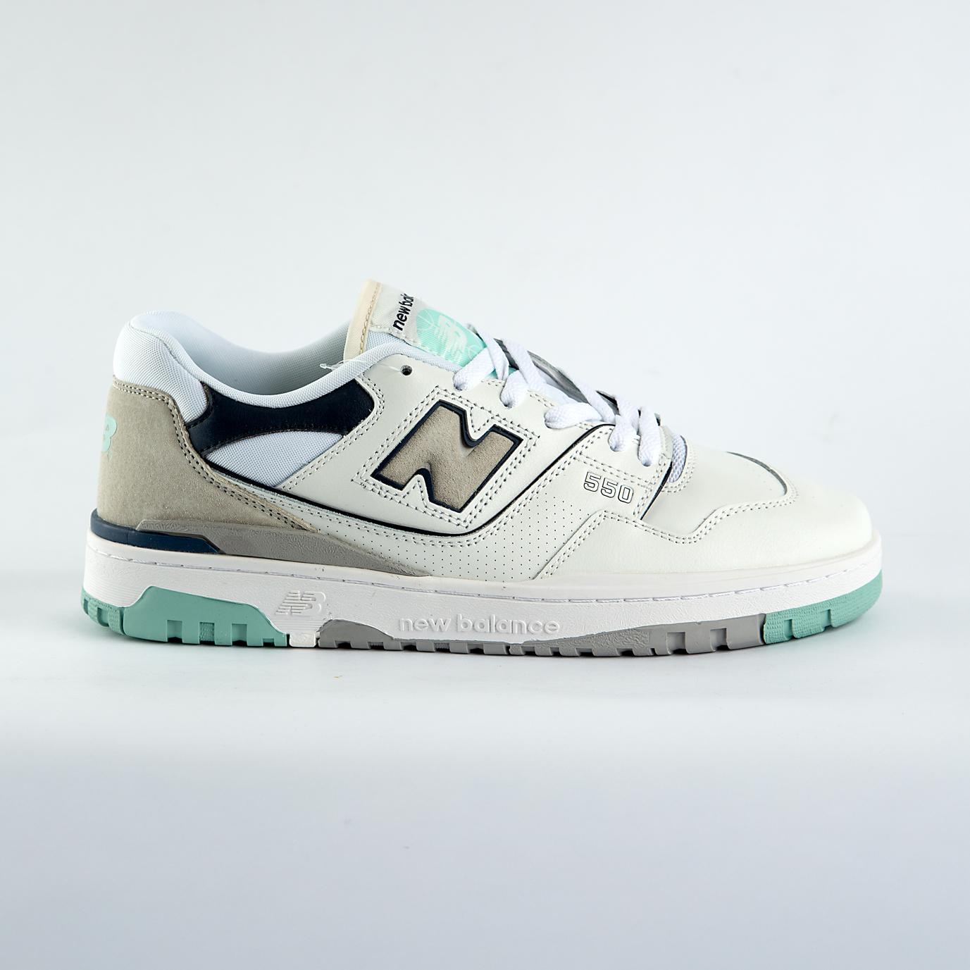 New Balance 550 sneakers in off-white with mint green, taupe, and gray accents. A retro low-top shoe for men and women.