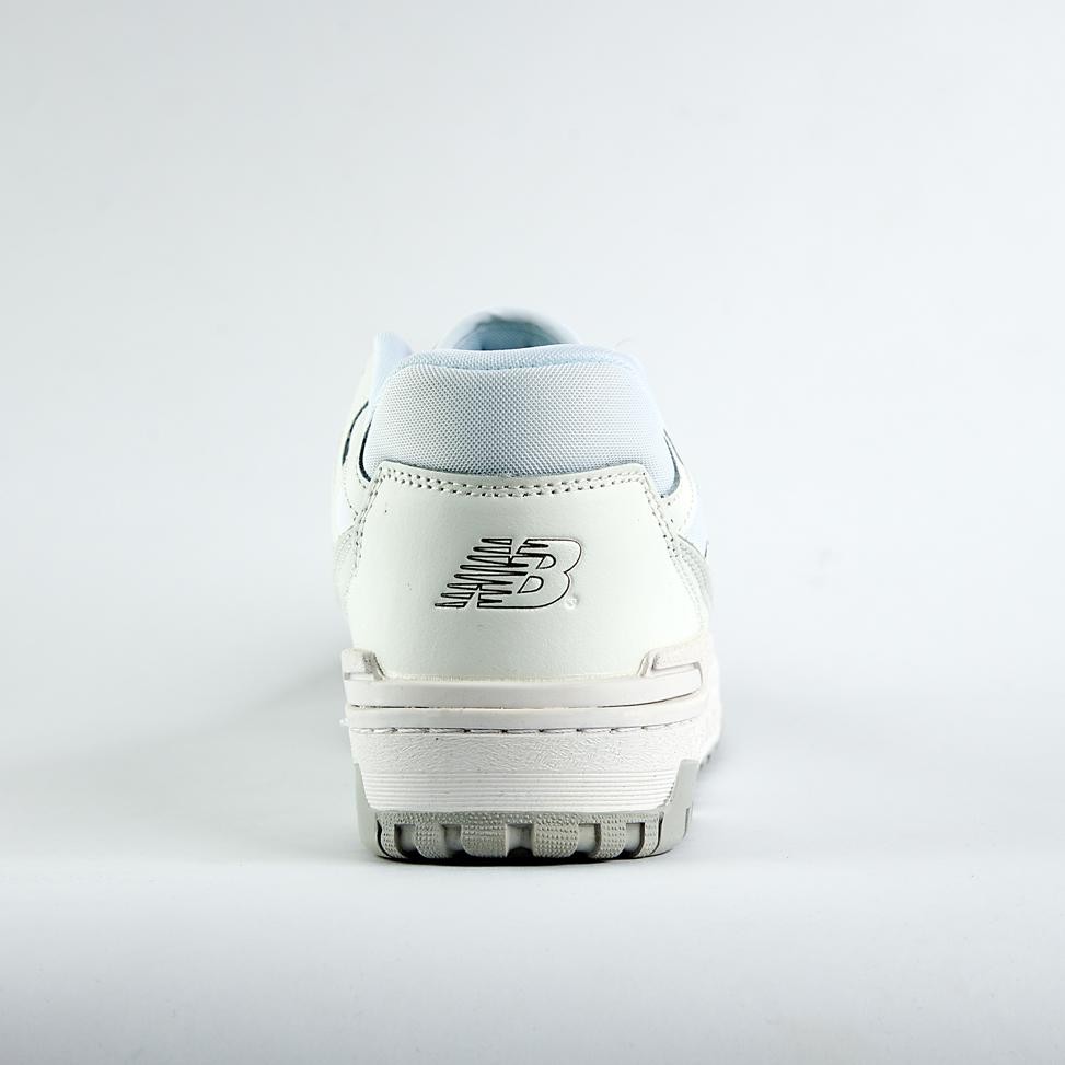    New Balance 550 sneakers in an off-white and light gray colorway. A classic low-top style with a minimalist look for men and women.