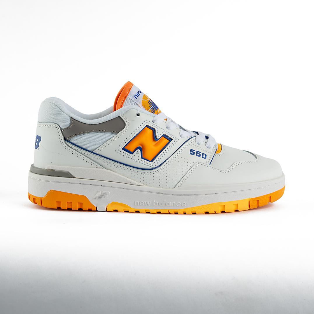 New Balance 550 sneakers in white with orange and gray details. A retro low-top shoe suitable for men and women.