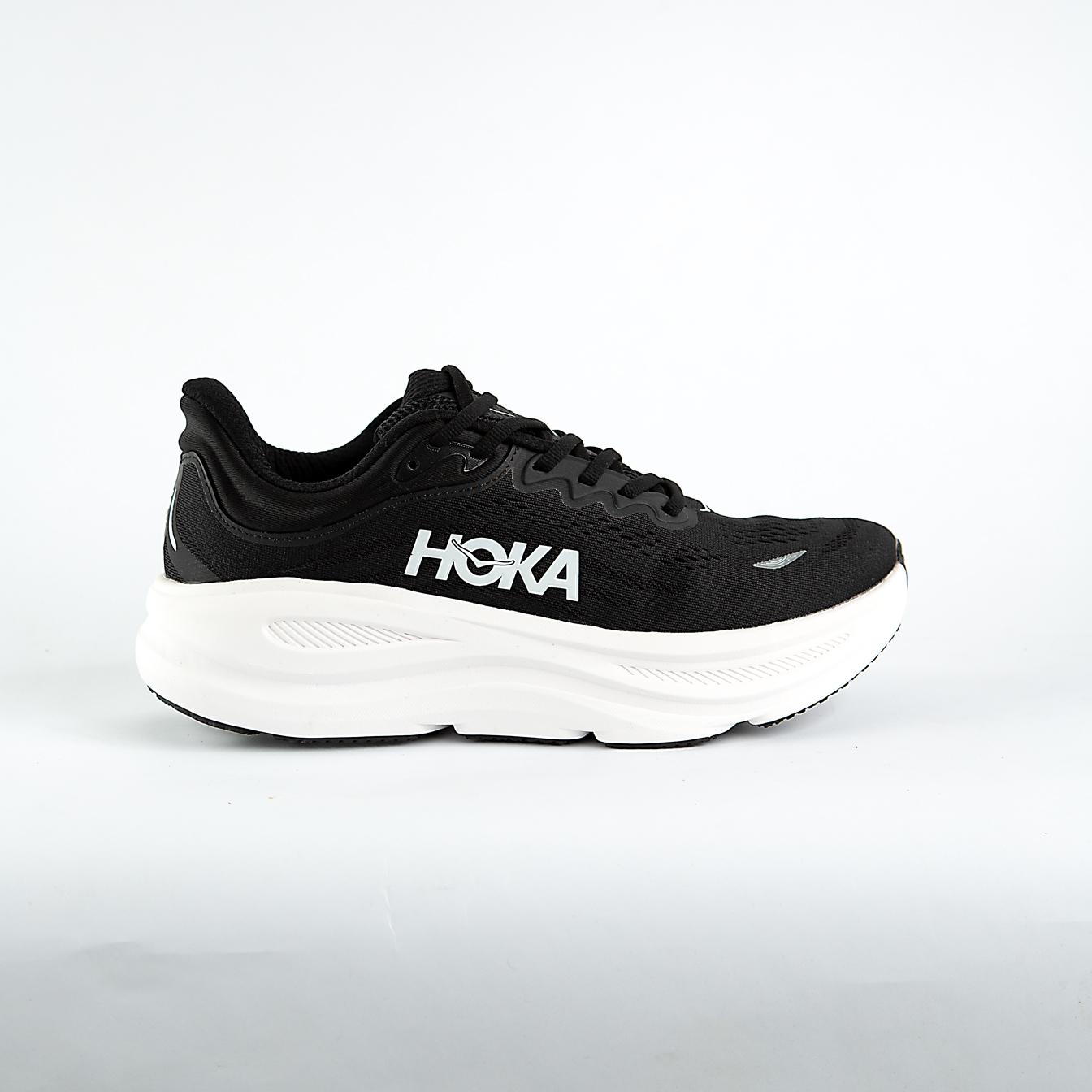 A pair of black and white Hoka Bondi 9 Sneakers cushioned road running shoes, known for maximum comfort and support for everyday runs and walks.