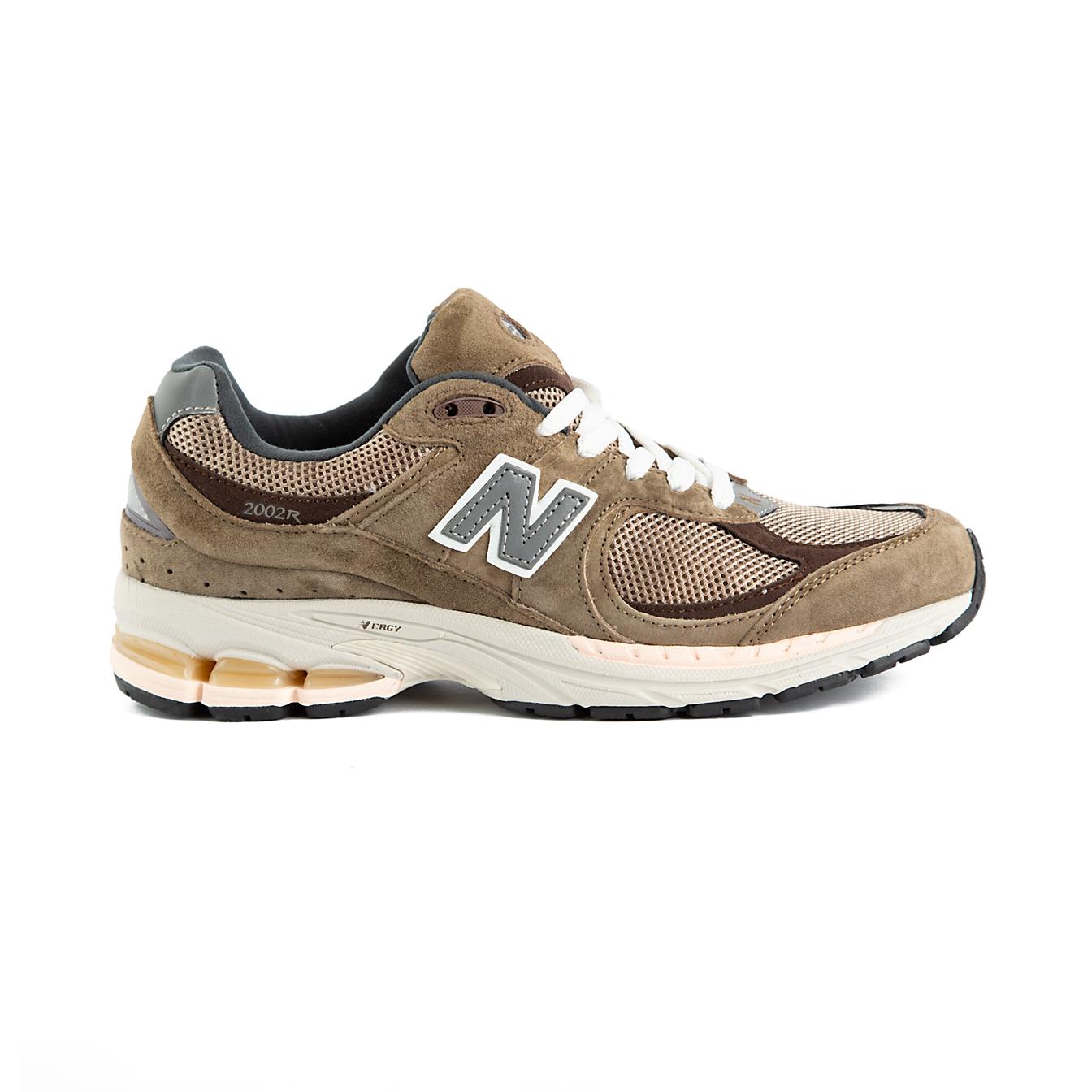 Pair of New Balance 2002R brown and beige sneakers on a white background