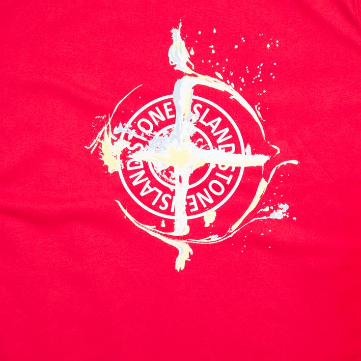 Scarlet red Stone Island t-shirt with distressed Compass logo graphic on chest, short sleeves, designer casual wear.