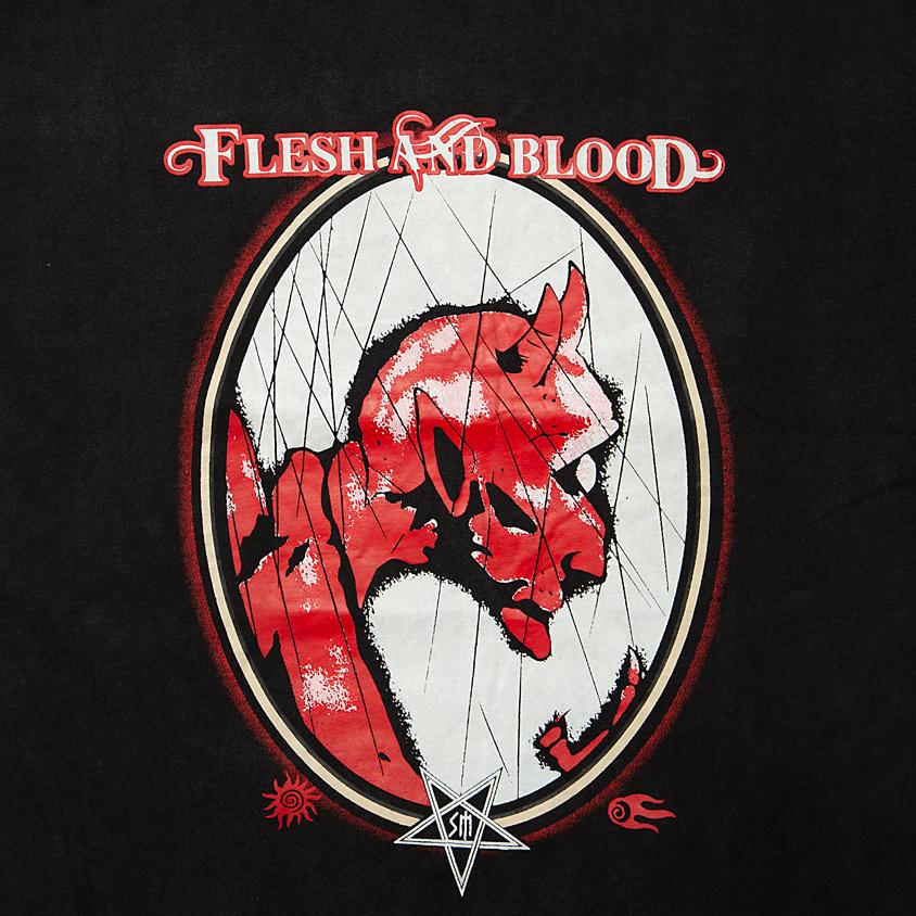 A black, short-sleeve t-shirt with a vintage, washed or faded finish, suggesting a distressed streetwear aesthetic.