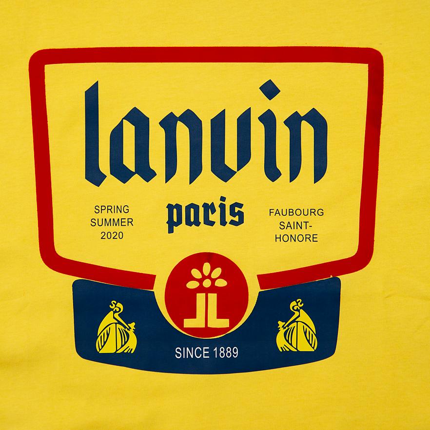 A vibrant, short-sleeved cotton T-shirt featuring a prominent, rectangular graphic print on the chest.