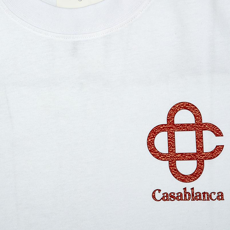 This is a white, short-sleeved, crew-neck T-shirt from the luxury French-Moroccan brand Casablanca.