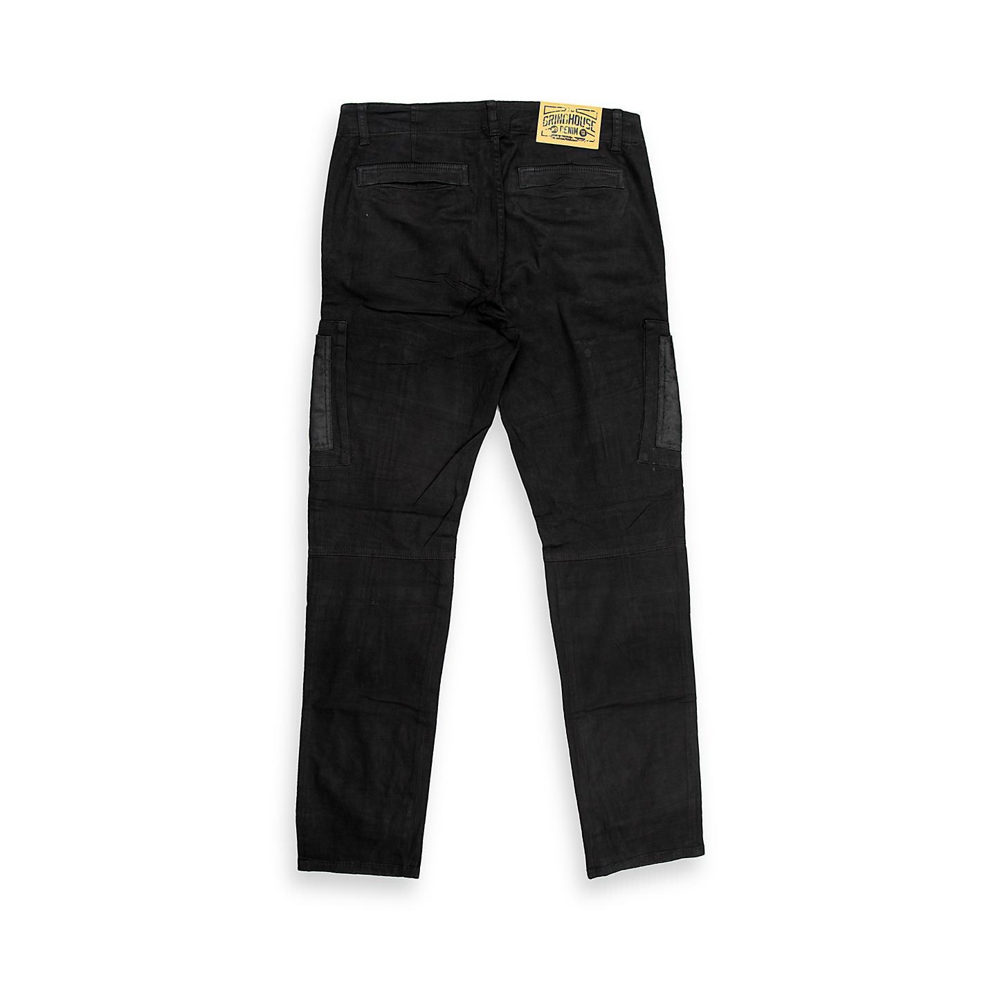 These are a pair of modern, slim-fit cargo pants (or utility trousers) in a solid black fabric. They feature a contemporary design that blends workwear utility with a streetwear aesthetic.