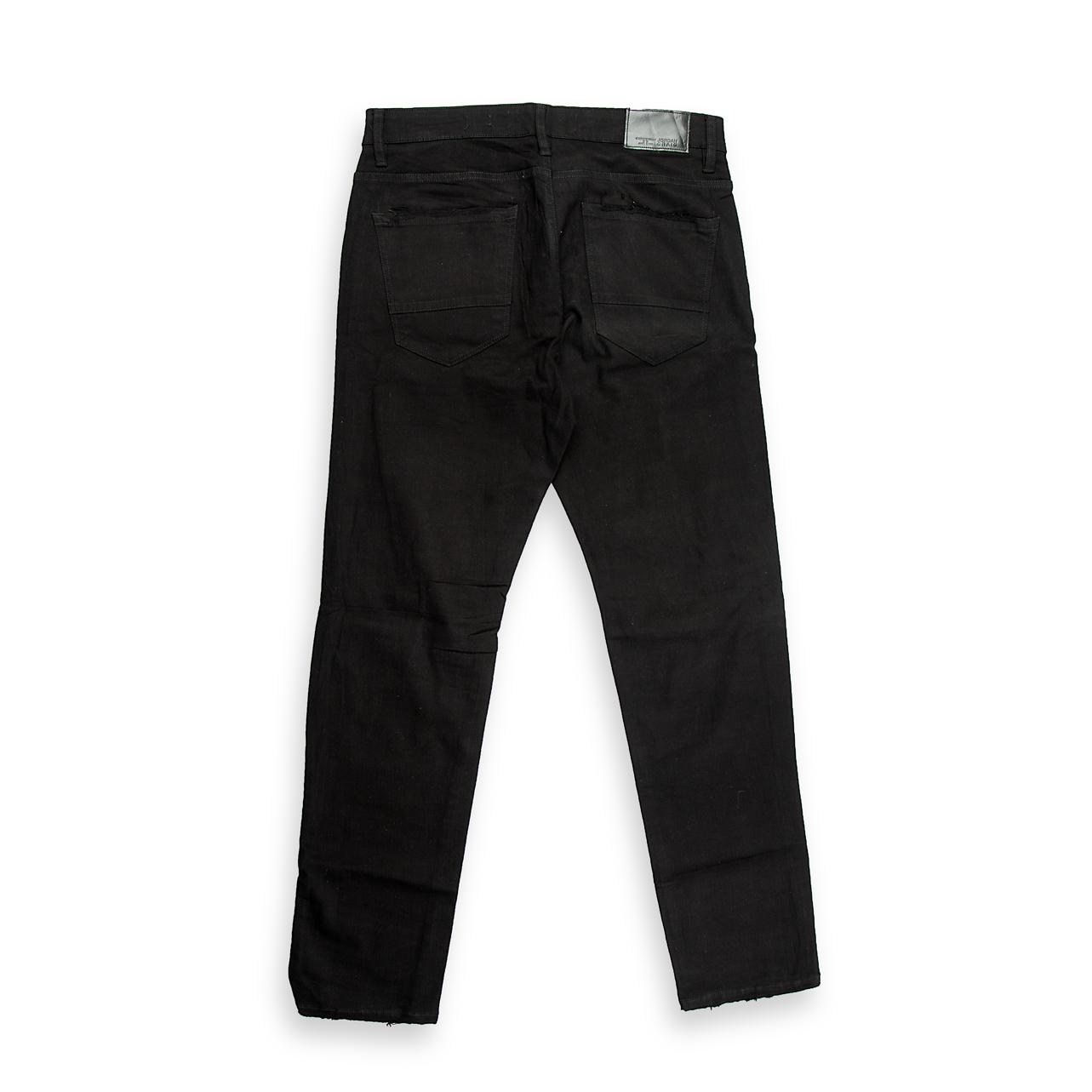 These are modern, slim-fit jeans for men, characterized by a deep, solid black wash (not faded).
