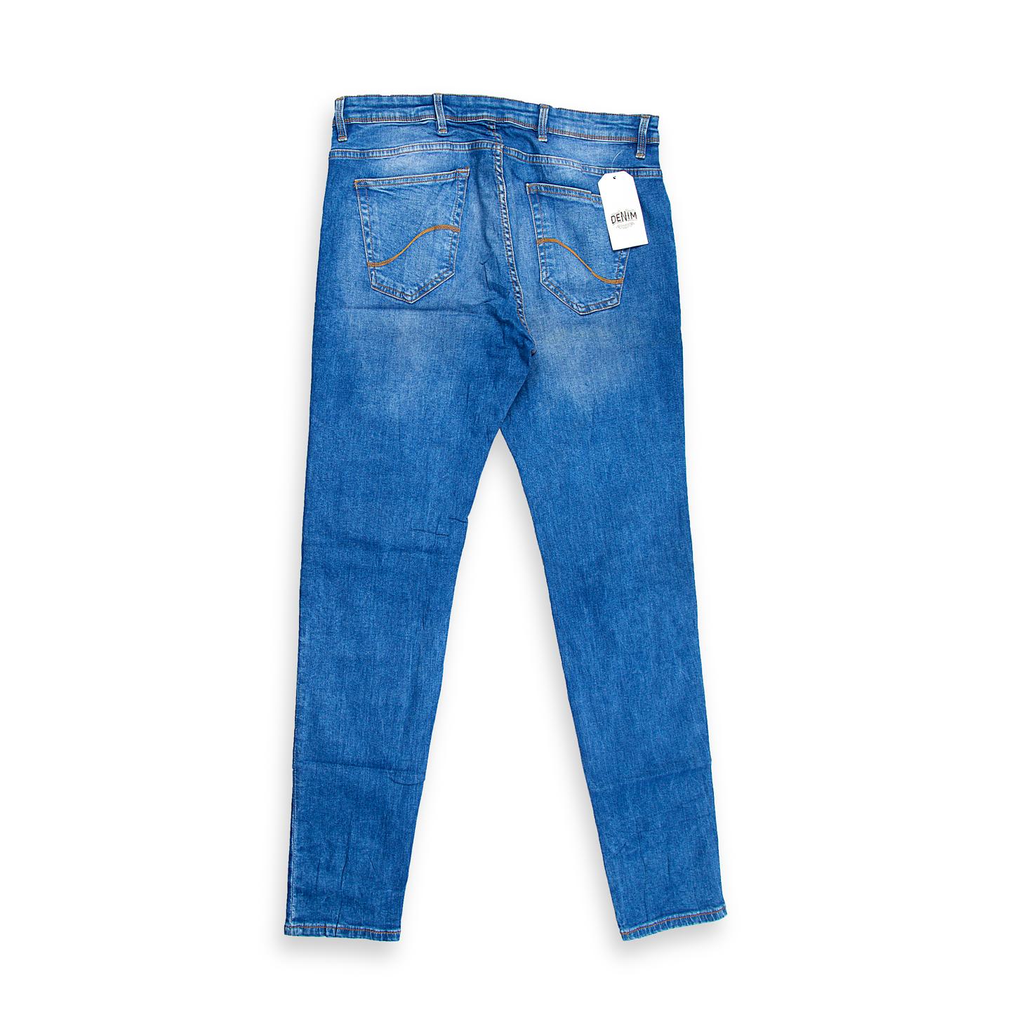 These are men's classic jeans featuring a versatile medium blue wash with a clean finish and natural-looking light fading/whiskering across the thigh area.