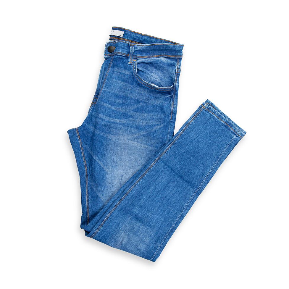 These are men's classic jeans featuring a versatile medium blue wash with a clean finish and natural-looking light fading/whiskering across the thigh area.