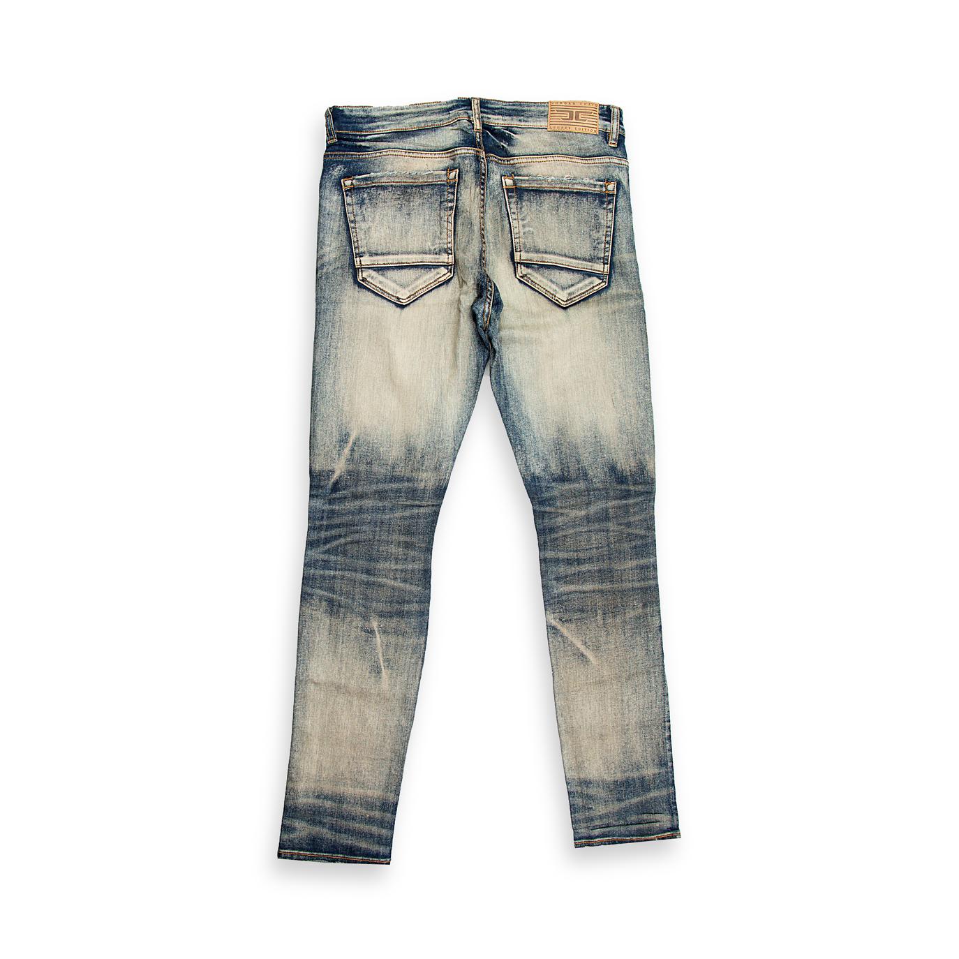 They feature an intense light blue/grey acid wash with a heavily bleached, almost marbleized texture, giving them a strong vintage 80s/90s grunge aesthetic.