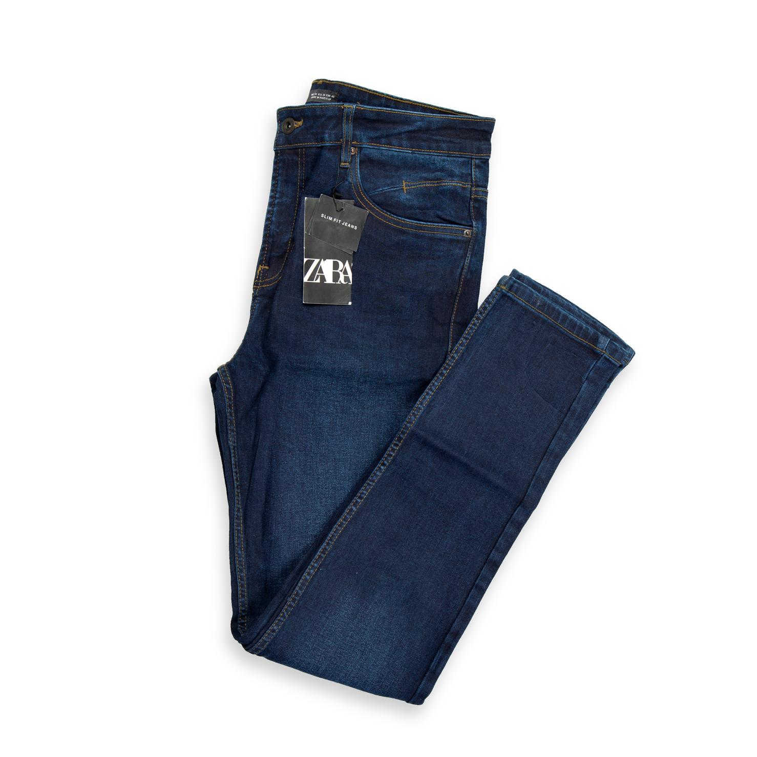 A modern, versatile pair of men's jeans in a deep, consistent dark indigo wash.