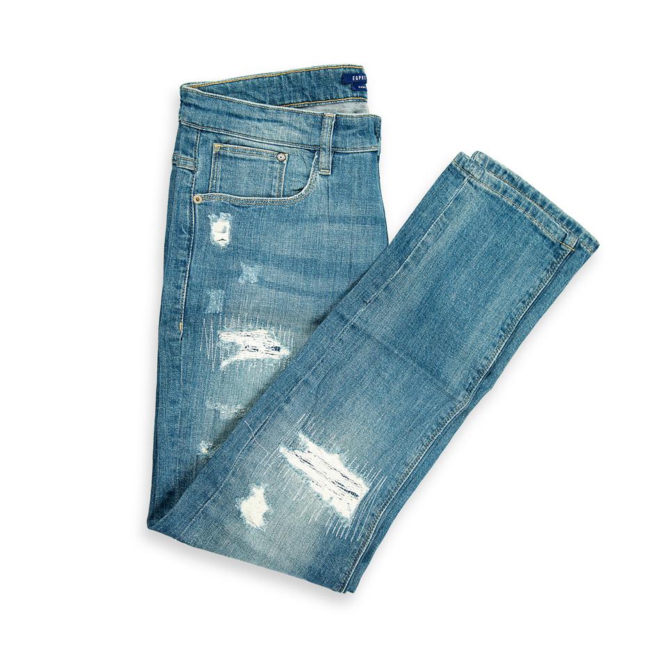 These are a pair of slim-fit jeans characterized by a light/medium blue acid wash (or heavily bleached wash), which gives the denim a highly faded, streaky appearance.
