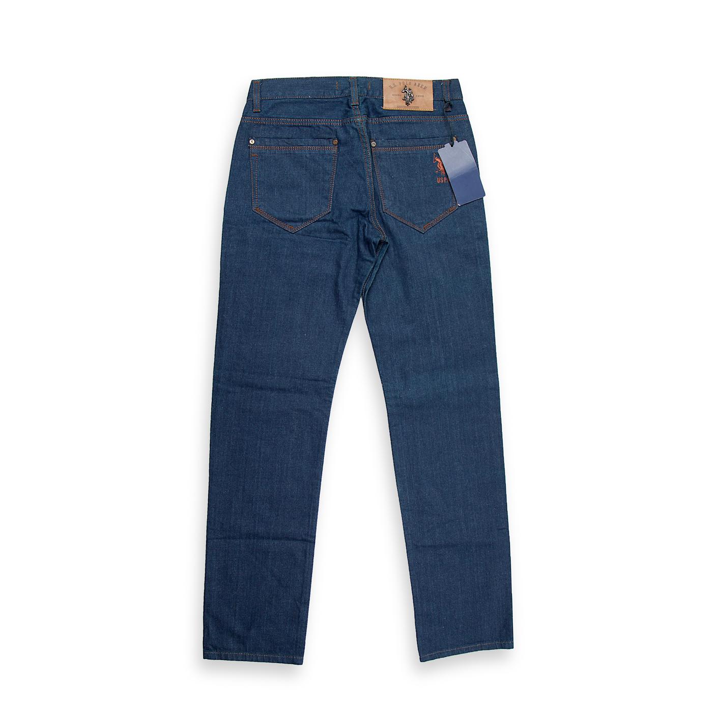 A timeless and essential piece for any wardrobe, these dark rinse jeans feature a deep, uniform indigo color with minimal to no fading or distressing, offering a sharp and clean aesthetic.