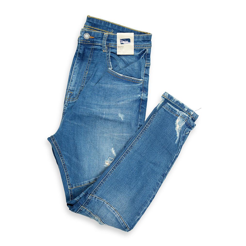 Designed for the style-conscious individual, these jeans feature an aggressive slim fit and key distressed details including rips, fading, and unique horizontal ribbing/seaming (biker paneling) on the knees.