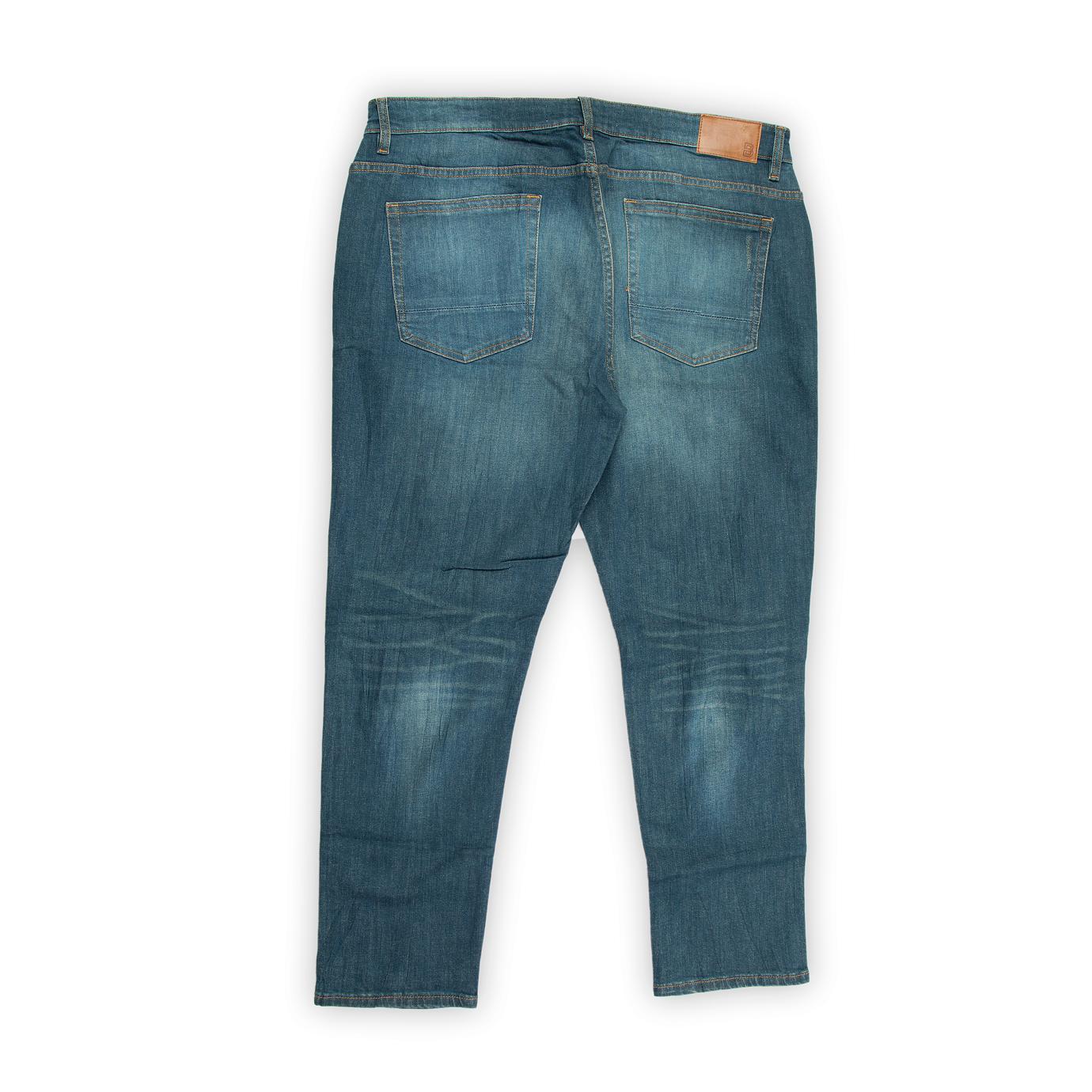 They feature a rich medium blue wash with natural fading and subtle whiskering, giving them an authentic, worn-in appearance.