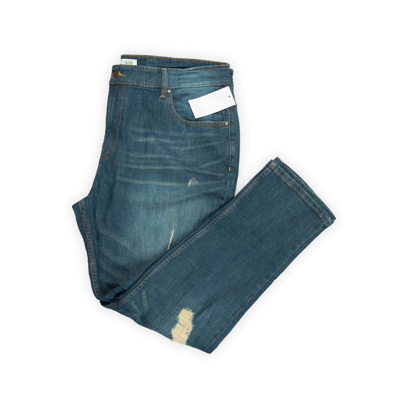 They feature a rich medium blue wash with natural fading and subtle whiskering, giving them an authentic, worn-in appearance.