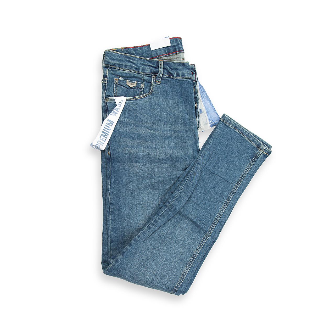 An essential pair of five-pocket jeans featuring a timeless, medium blue wash with minimal fading for a clean, versatile look.