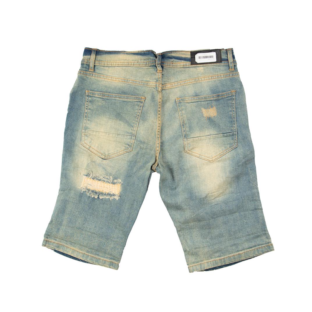 These bold, rugged shorts are designed to make a statement with their heavily destroyed aesthetic. They feature a light, vintage blue wash with significant fading and whiskering.