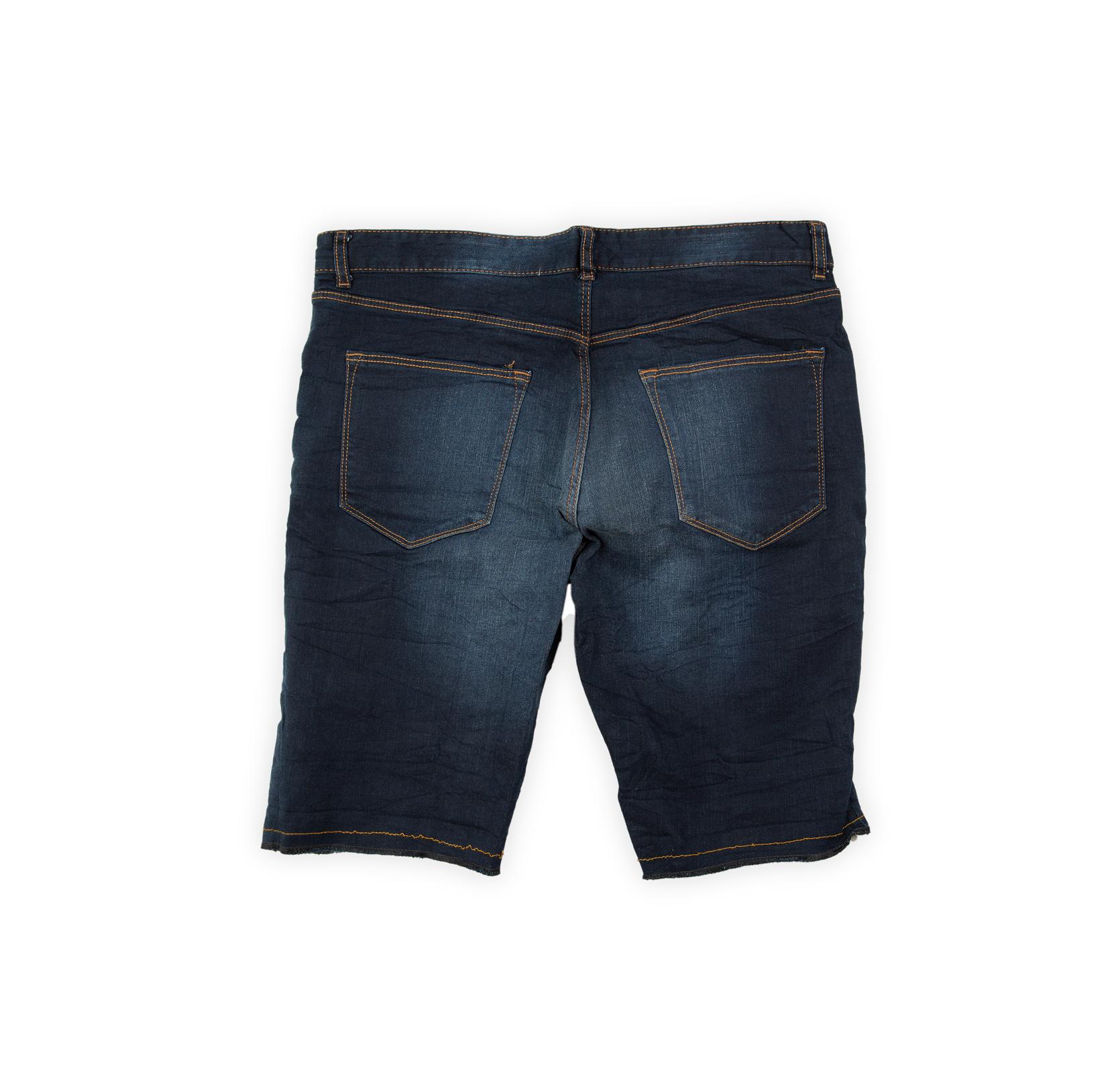 These shorts are a comfortable and rugged choice for warm weather. They feature a deep, dark indigo blue wash with moderate fading and whiskering concentrated on the thighs.