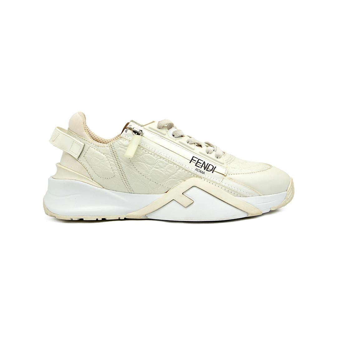 The Ivory Apex Trainer is a luxurious, modern running-inspired sneaker defined by its dramatic, chunky silhouette and premium detailing.