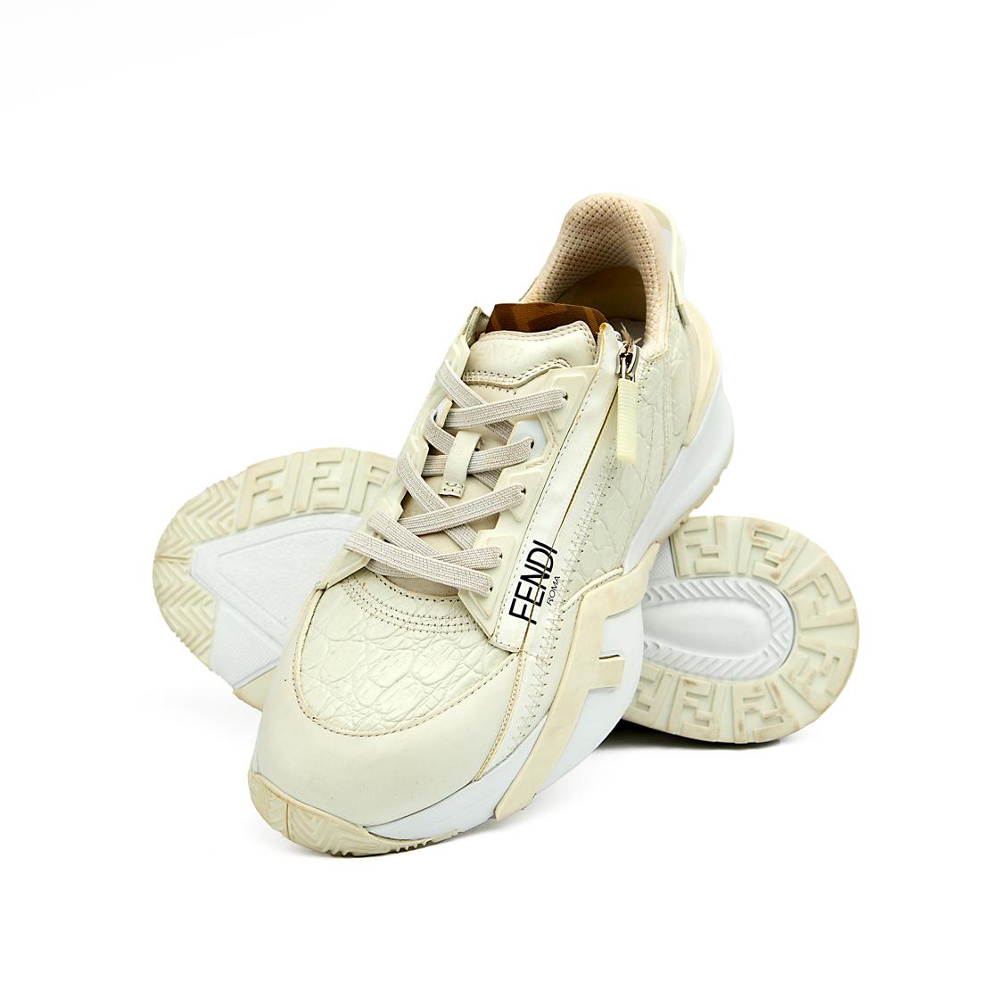 The Ivory Apex Trainer is a luxurious, modern running-inspired sneaker defined by its dramatic, chunky silhouette and premium detailing.