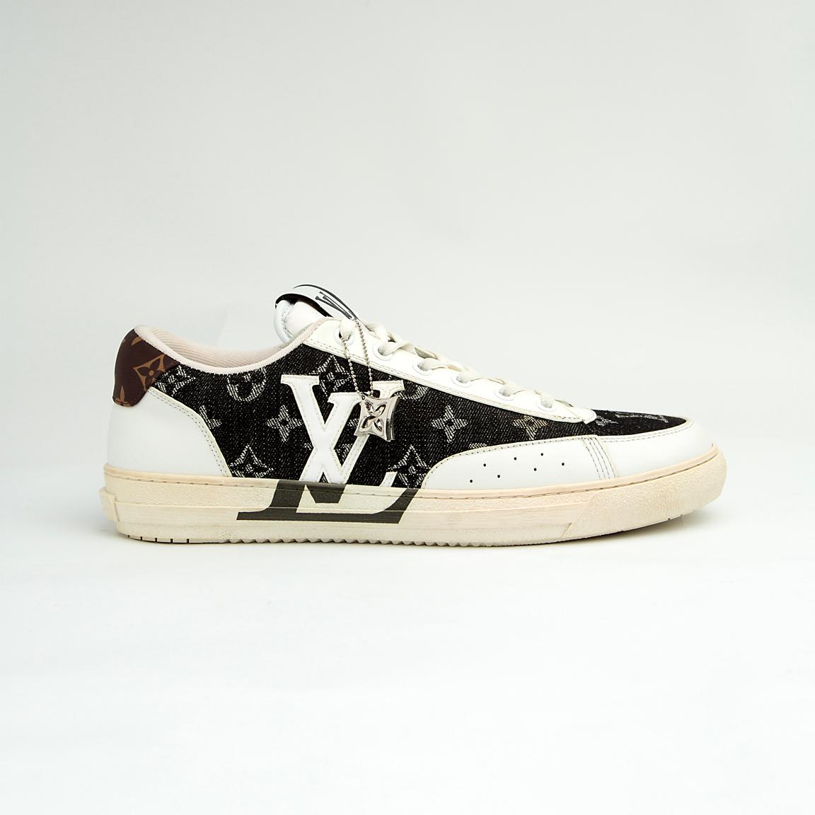 The LV Trainer Sneaker is a luxury low-top sneaker that blends high-fashion craftsmanship with a retro basketball and skate shoe aesthetic.