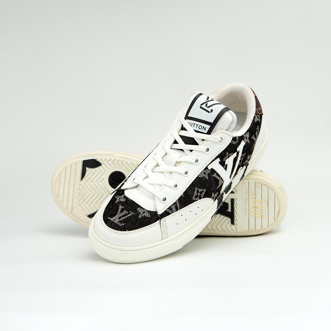 The LV Trainer Sneaker is a luxury low-top sneaker that blends high-fashion craftsmanship with a retro basketball and skate shoe aesthetic.