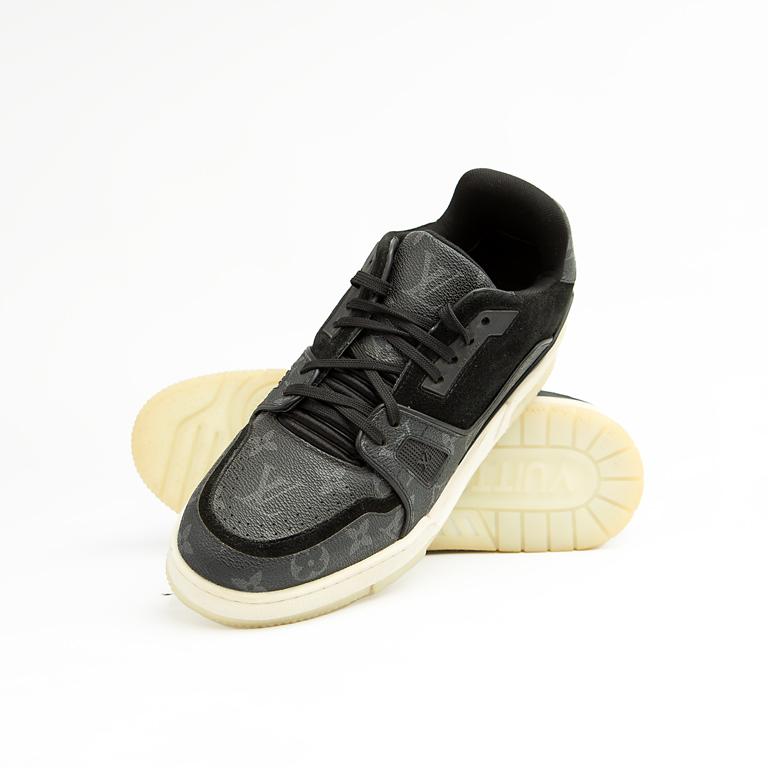 The Obsidian Monogram Ace is a high-fashion low-top sneaker that remixes a vintage court shoe silhouette with signature luxury detailing.