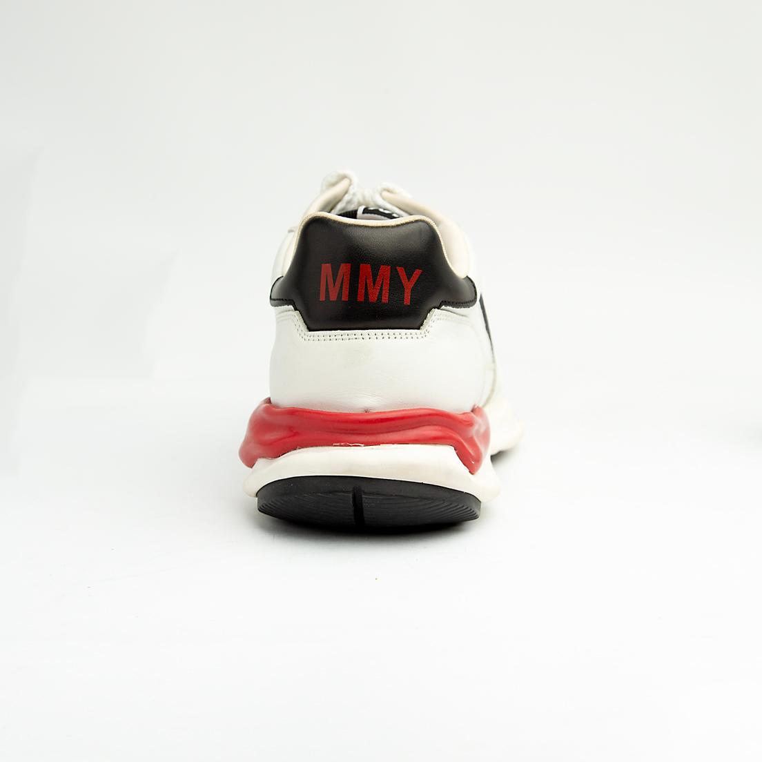 This bold sneaker features sophisticated color blocking with a base of pristine white leather, accented by rich navy blue mesh on the toe box and side panels, and black suede/nubuck near the laces.