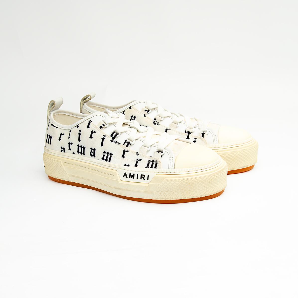 These statement sneakers capture the brand's signature rock-and-roll aesthetic with an eye-catching all-over, black, gothic-style script print on a crisp white canvas upper.