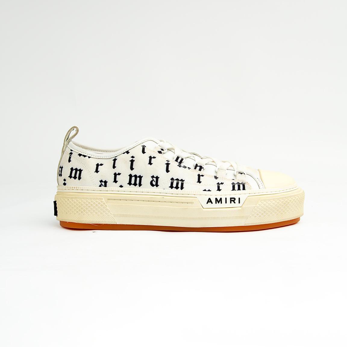 These statement sneakers capture the brand's signature rock-and-roll aesthetic with an eye-catching all-over, black, gothic-style script print on a crisp white canvas upper.