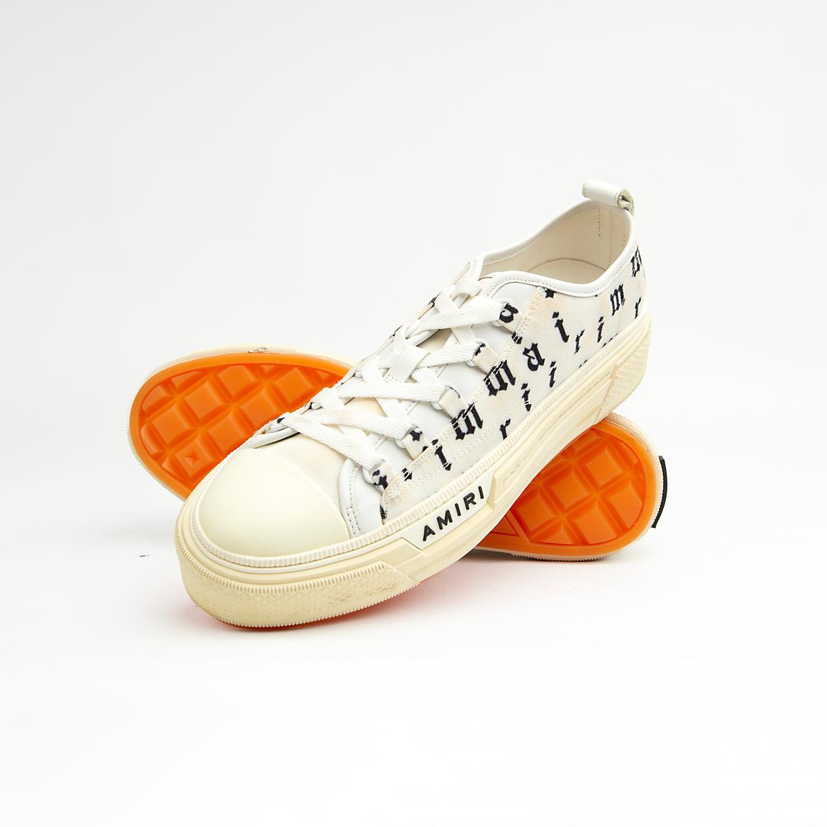 These statement sneakers capture the brand's signature rock-and-roll aesthetic with an eye-catching all-over, black, gothic-style script print on a crisp white canvas upper.