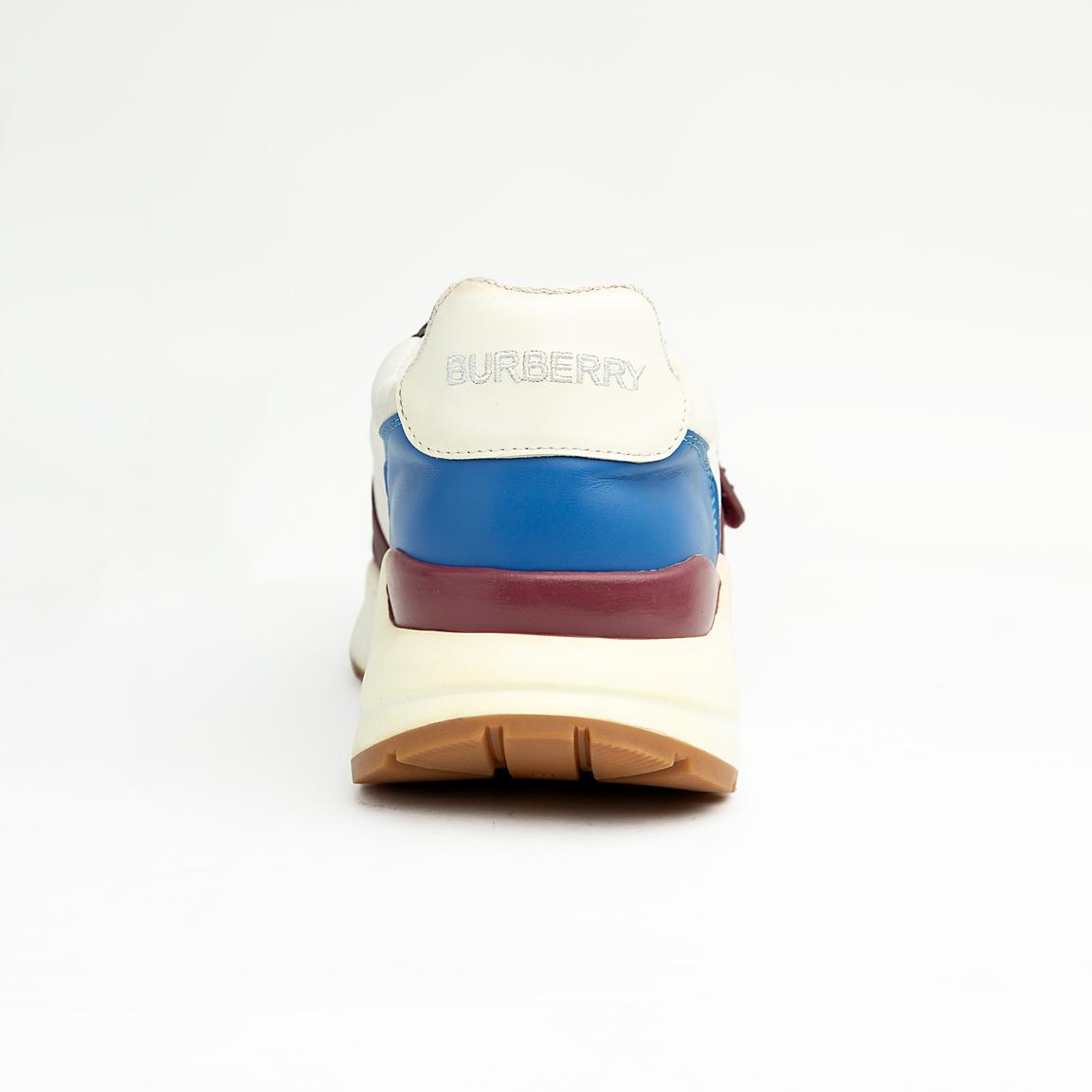 Stylish unisex multi-tone sneakers with adjustable strap, yellow laces, and cushioned sole — perfect for casual and streetwear looks.