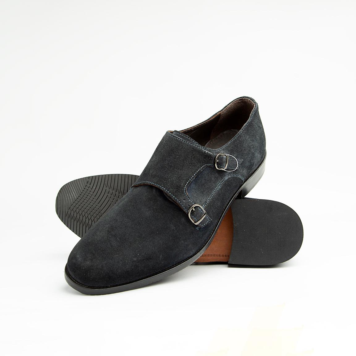 Crafted from luxurious, deep navy blue suede, these sophisticated dress shoes feature the distinguished double monk strap closure with polished silver-tone buckles, offering a timeless and secure fit.