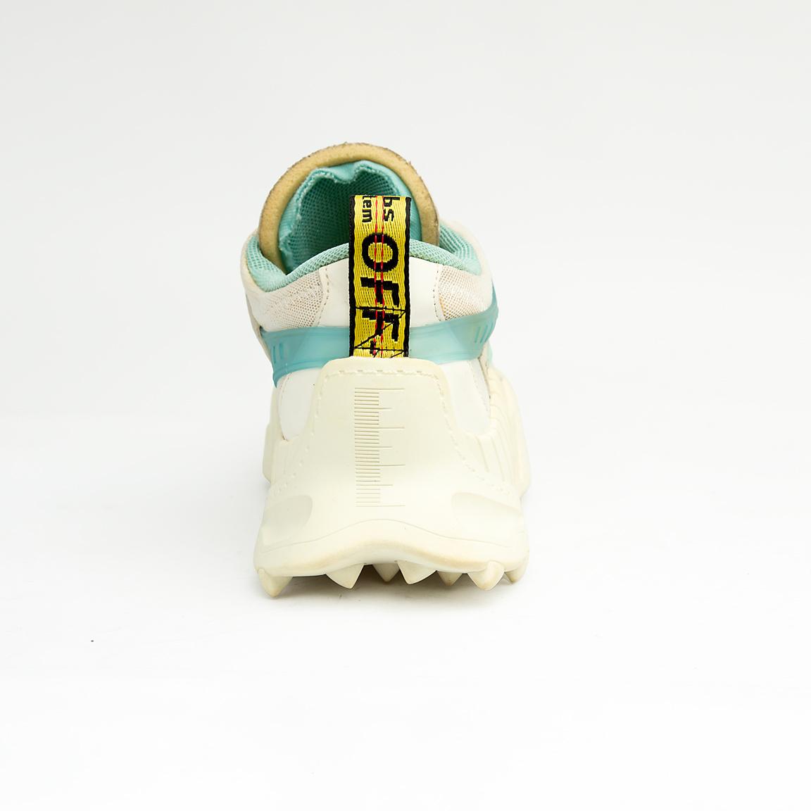 Chunky cream and mint green unisex mesh sneakers with rugged soles and gradient side detail for a sporty modern look.