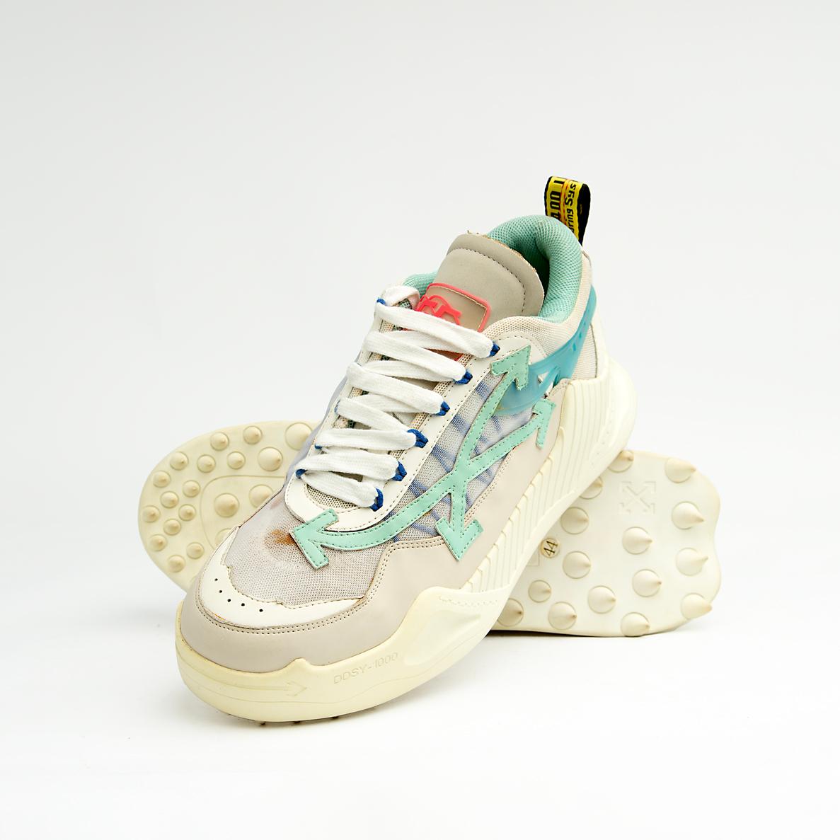 Chunky cream and mint green unisex mesh sneakers with rugged soles and gradient side detail for a sporty modern look.