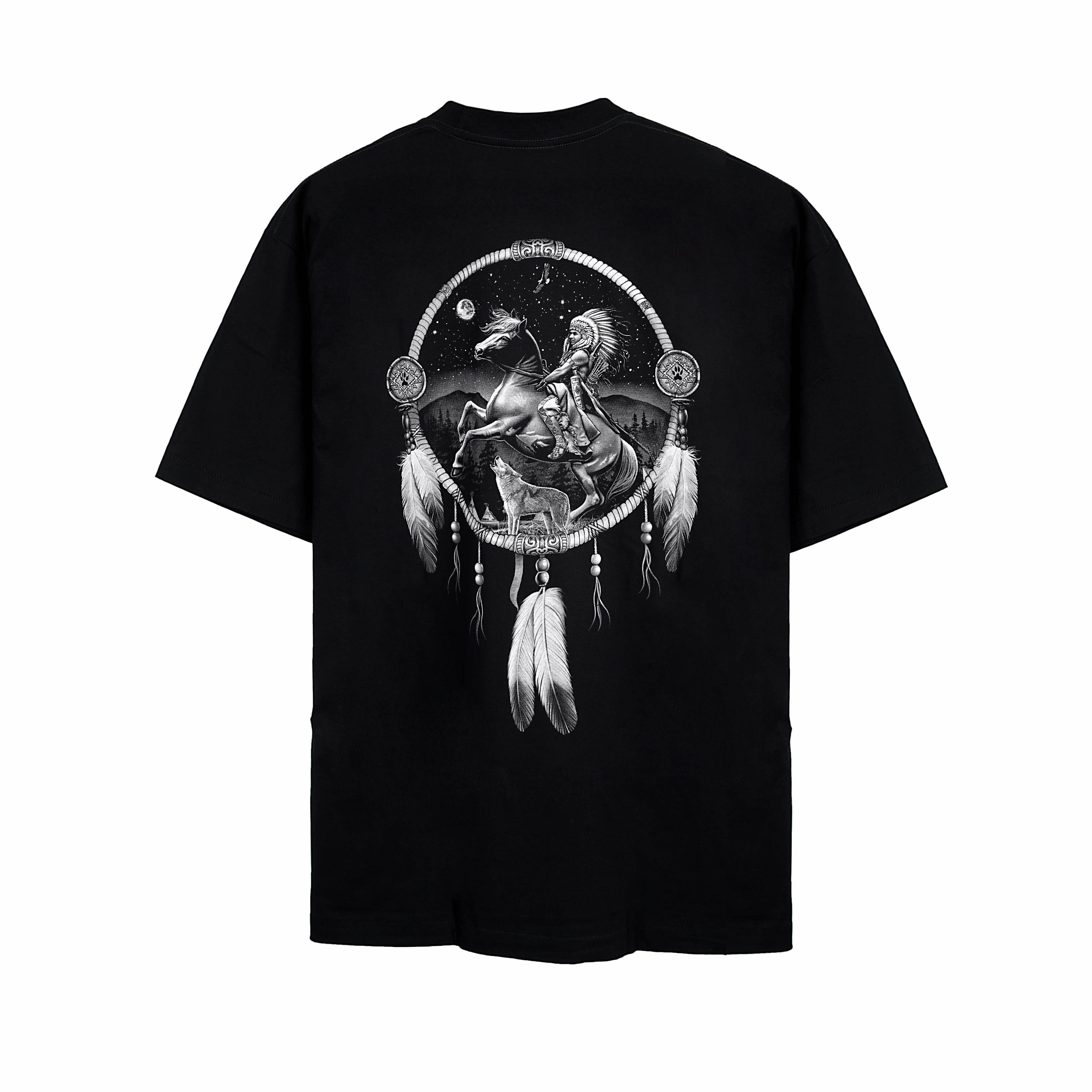 Rock Eagle black unisex t-shirt with a detailed graphic of a Native American Chief in a feather bonnet kneeling by a campfire near a teepee under a star-lit night sky.