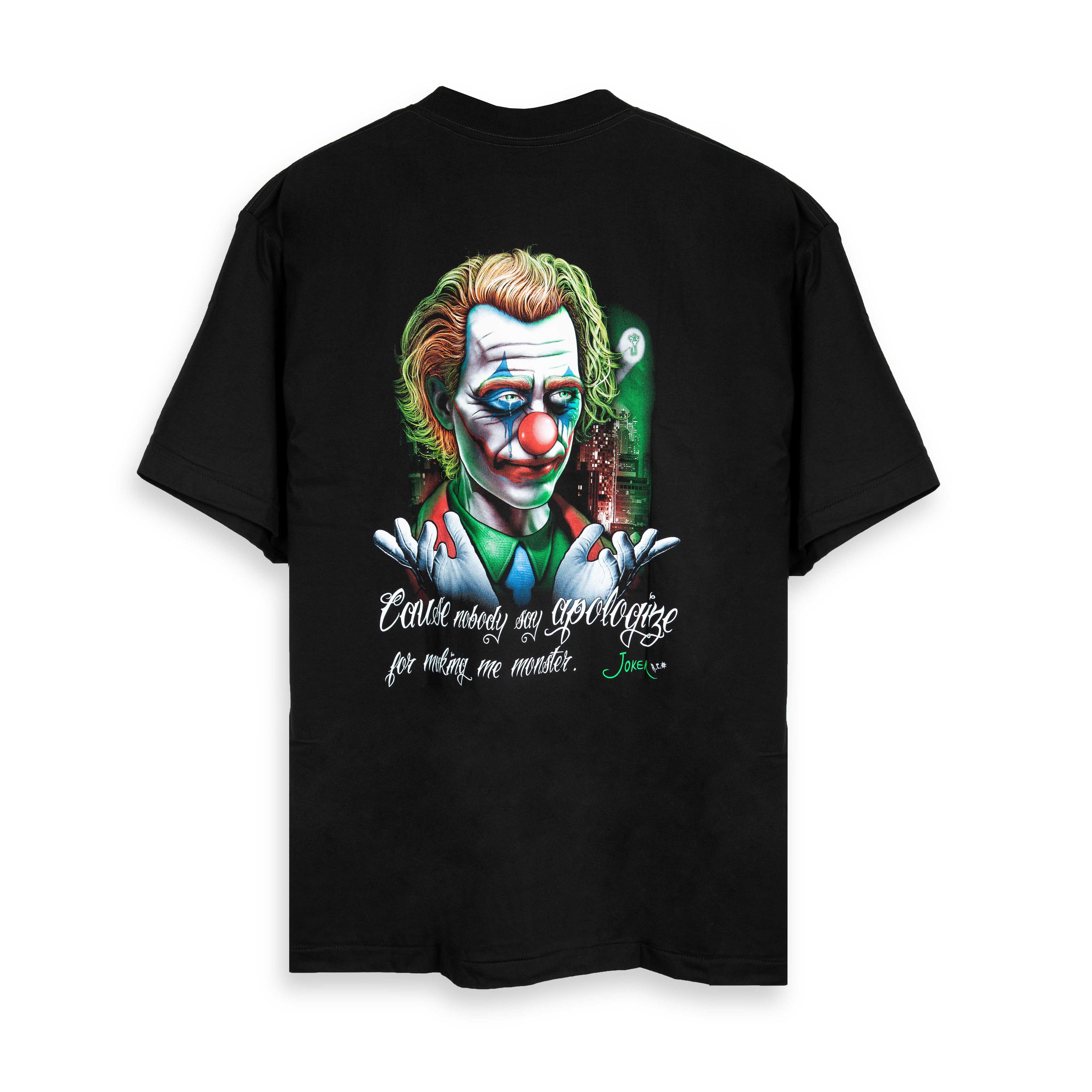 Rock Eagle black t-shirt with a detailed, colorful graphic of the Joker's face, clown makeup, and the quote "Why should I say sorry for my monster?" in red script.