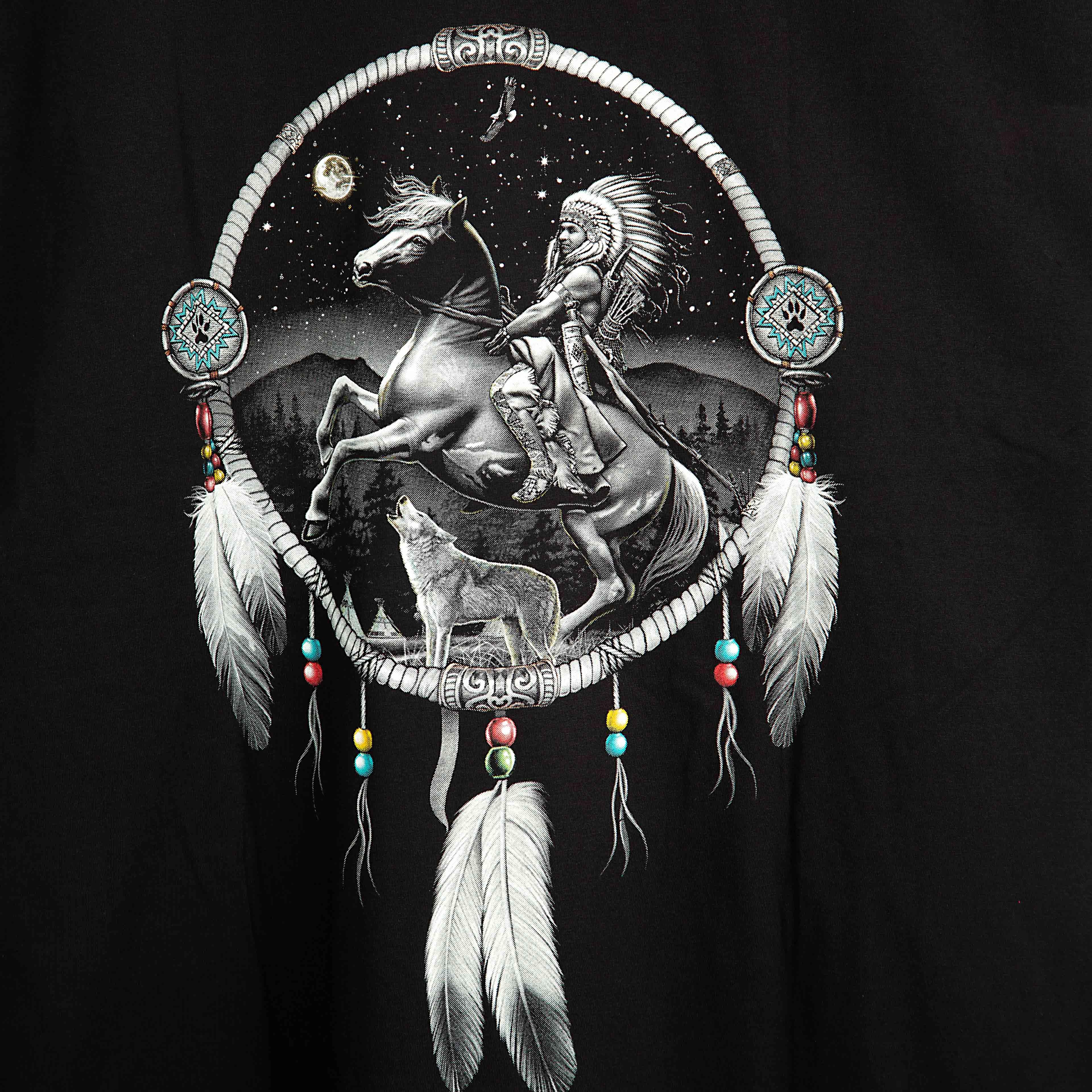 Rock Eagle black unisex t-shirt with a detailed graphic of a Native American Chief in a feather bonnet kneeling by a campfire near a teepee under a star-lit night sky.